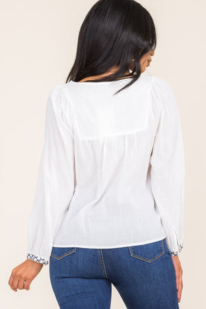 ROUND NECK X EMBROIDERY LONG SLEEVE ENDIG DETAIL